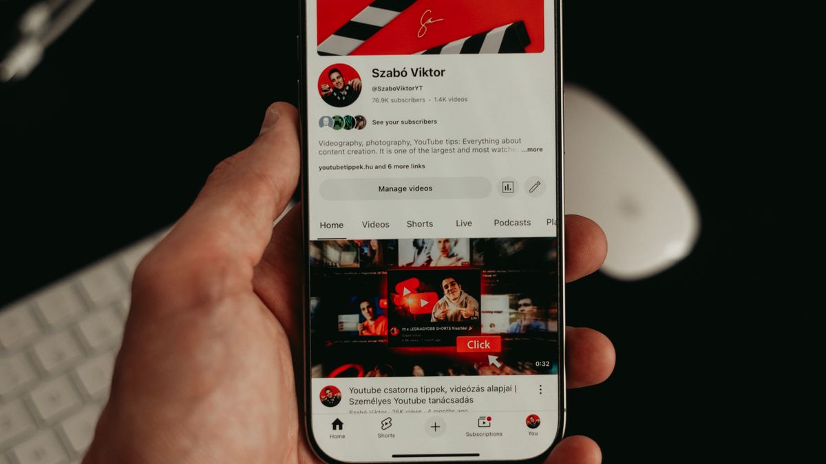 Hand holding a phone with streaming apps open